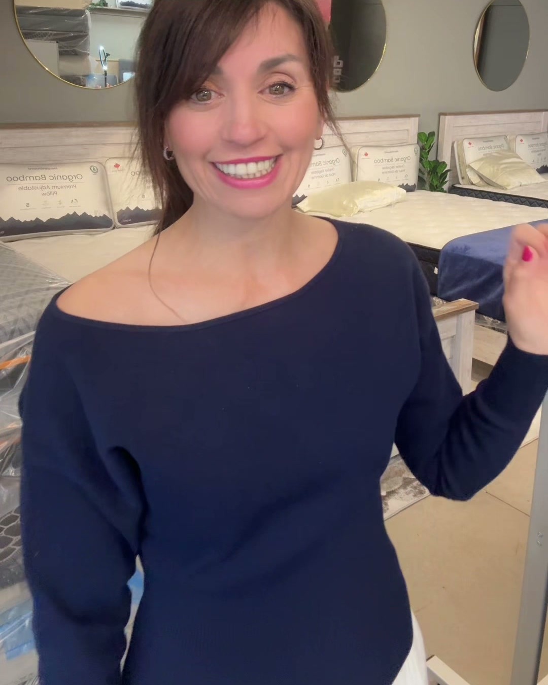 Leanne, founder of Love Sleep Mattress Co., smiling in her Ontario mattress store